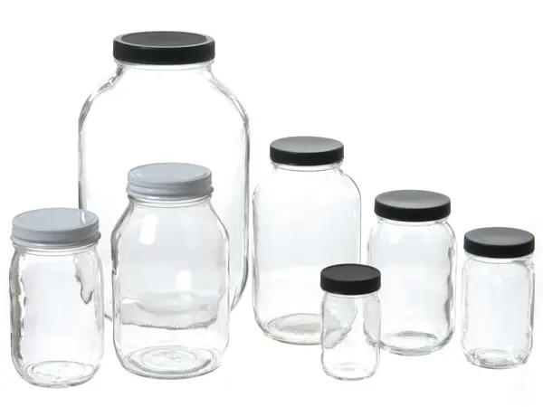 Glass spice jars with black plastic lids. 4 in tall. Diameter 2 in